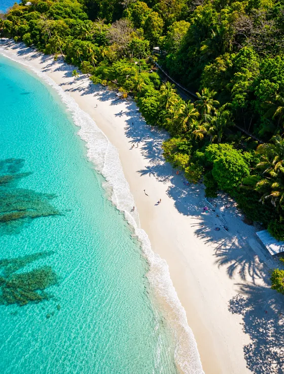 Aerial view of Playa Blanca's white sand and turquoise water in Puntarenas, Costa Rica