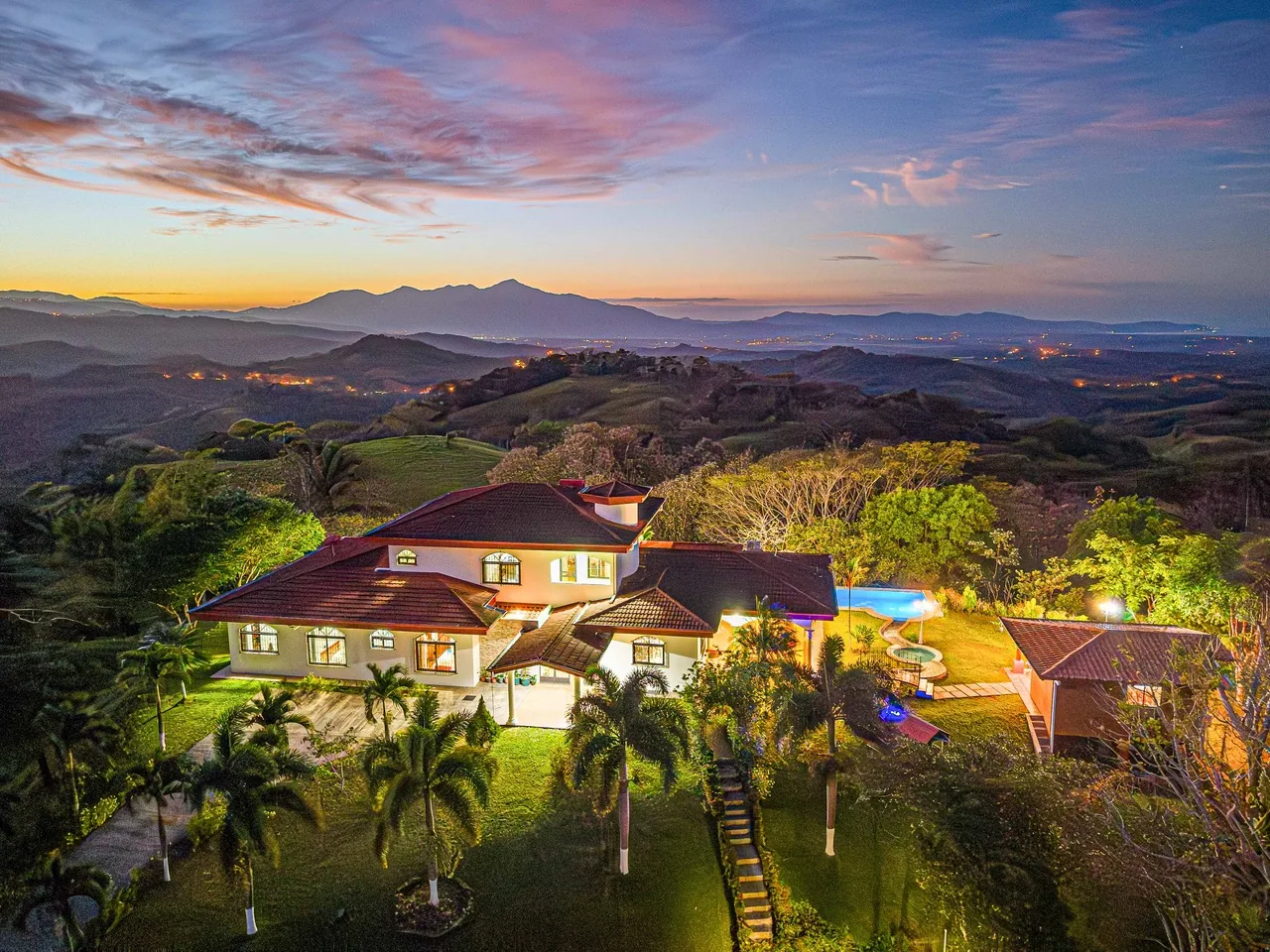 Bella Vista Private Resort's four homes and infinity pool at twilight